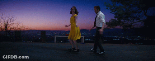 Man And Woman Dancing At Sunset City GIF