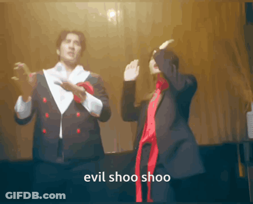 Man And Woman Dancing Evil Shoo Shoo GIF