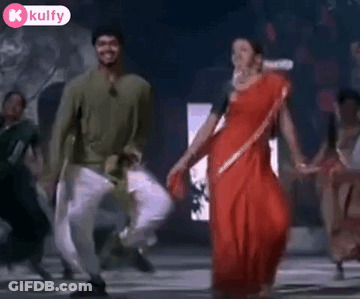 Man And Woman Dancing Hand In Hand GIF