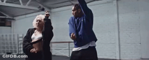 Man And Woman Dancing In A Dance Studio GIF