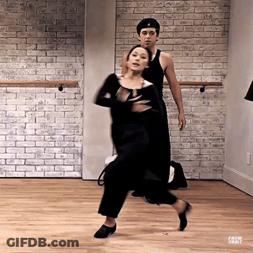 Man And Woman Dancing In Brick Studio GIF