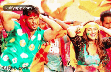 Man And Woman Dancing In Colored Powder GIF