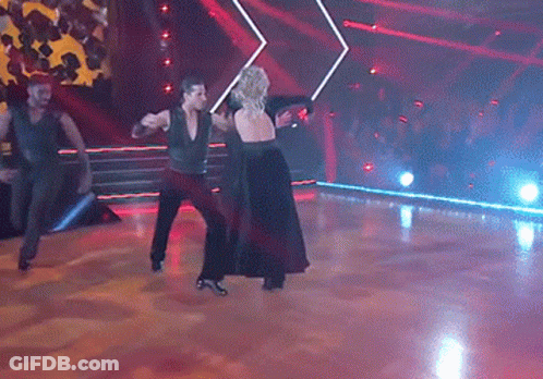 Man And Woman Dancing In Dark Room GIF