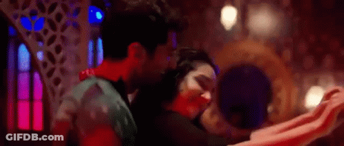 Man And Woman Dancing In Dark Room In Front Of Mirror GIF