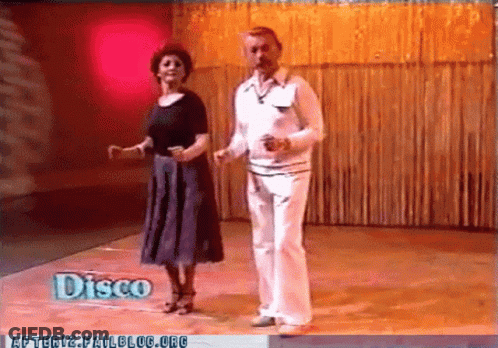 Man And Woman Dancing In Disco GIF