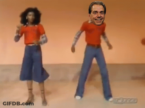 Man And Woman Dancing In Front Of BC Juice Sign GIF