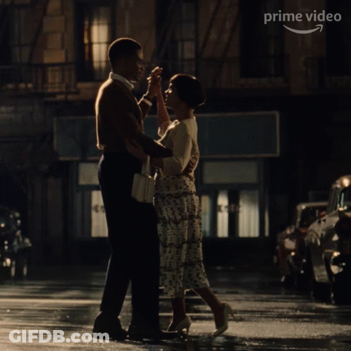 Man And Woman Dancing In Front Of Cafe GIF