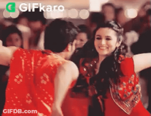 Man And Woman Dancing In Front Of Crowd GIF