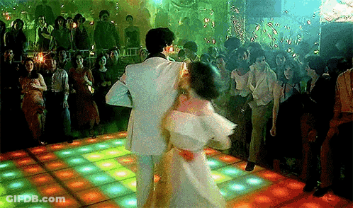 Man And Woman Dancing In Front Of Crowd GIF