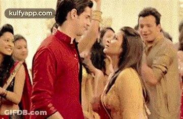Man And Woman Dancing In Front Of Crowd GIF