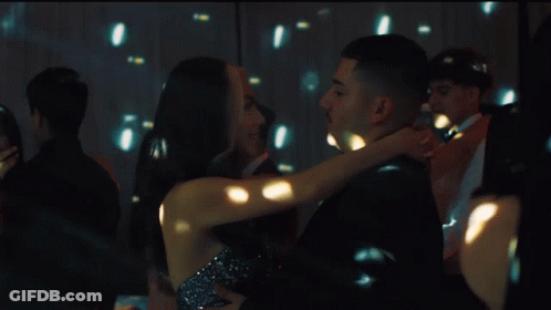 Man And Woman Dancing In Front Of Disco Ball GIF