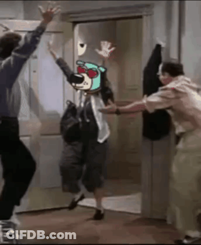 Man And Woman Dancing In Front Of Door With Picture Of Bear On Head GIF