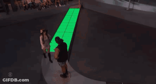 Man And Woman Dancing In Front Of Hotel Sign GIF