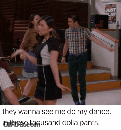 Man And Woman Dancing In Front Of Just Play Sign GIF