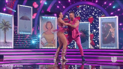 Man And Woman Dancing In Front Of La Sirena Cards GIF