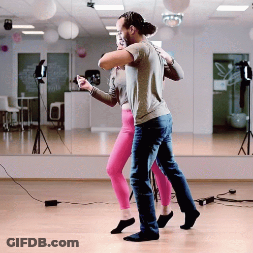 Man And Woman Dancing In Front Of Mirror GIF