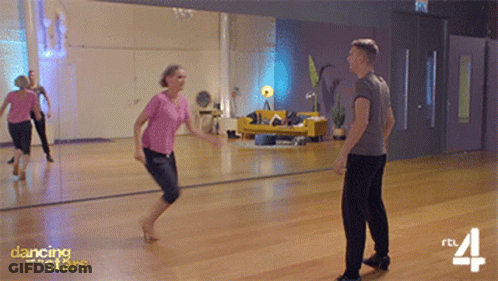 Man And Woman Dancing In Front Of Mirror GIF