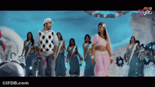 Man And Woman Dancing In Front Of Screen Saying MCA GIF