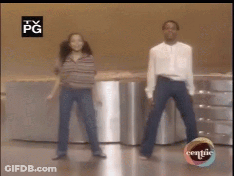 Man And Woman Dancing In Front Of TV GIF