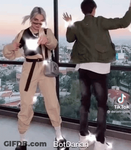 Man And Woman Dancing In Front Of Window GIF