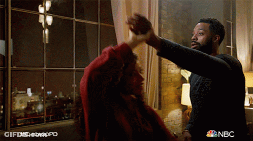 Man And Woman Dancing In Front Of Window NBC GIF