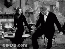 Man And Woman Dancing In Living Room Black And White GIF