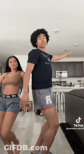 Man And Woman Dancing In Living Room GIF