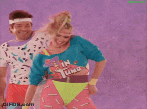 Man And Woman Dancing In Neon Clothes GIF