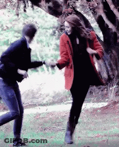 Man And Woman Dancing In Park GIF