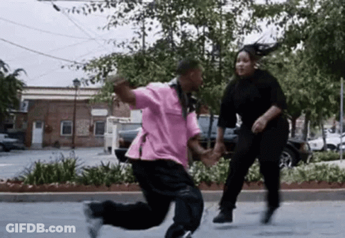Man And Woman Dancing In Parking Lot GIF