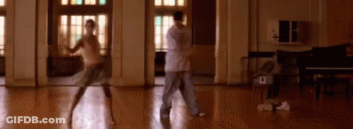 Man And Woman Dancing In Room With Piano GIF