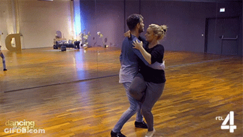 Man And Woman Dancing In Studio With Dancing Stars GIF