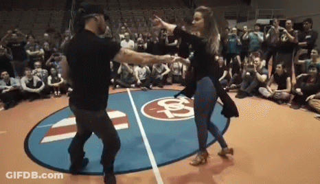 Man And Woman Dancing On Basketball Court GIF