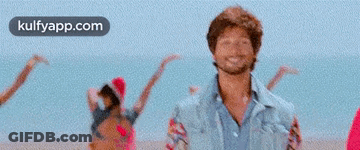 Man And Woman Dancing On Beach GIF
