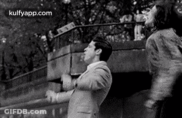 Man And Woman Dancing On Bridge GIF