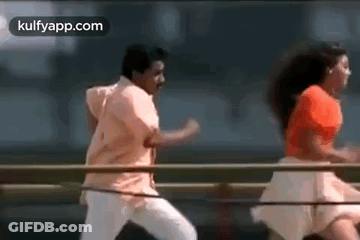 Man And Woman Dancing On Bridge GIF