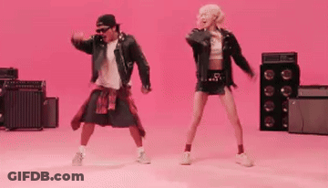 Man And Woman Dancing On Pink GIF