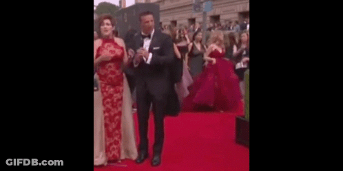 Man And Woman Dancing On Red Carpet GIF