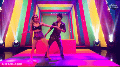 Man And Woman Dancing On Stage Saying Dancing Brasil GIF