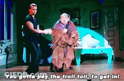 Man And Woman Dancing On Stage Saying You Gotta Pay The Troll Toll GIF