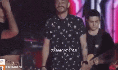 Man And Woman Dancing On Stage With Band GIF