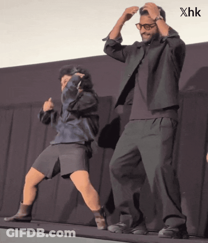 Man And Woman Dancing On Stage With XHK GIF