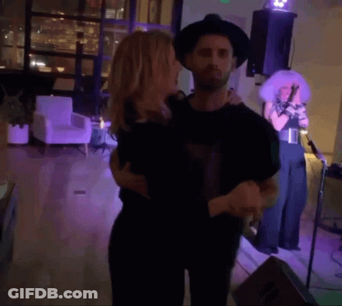 Man And Woman Dancing On Stage, Woman Singing GIF