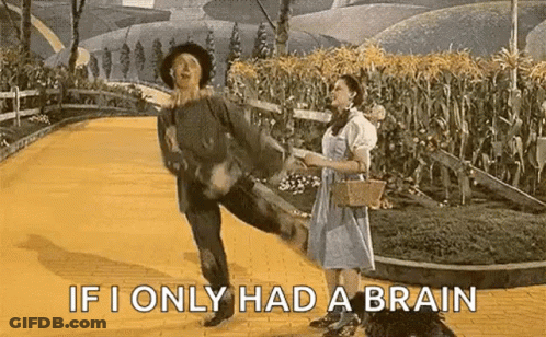 Man And Woman Dancing On Yellow Brick Road GIF