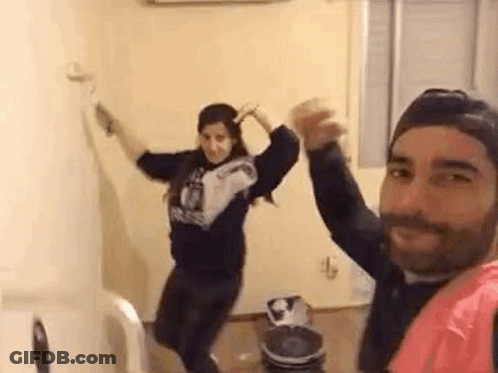Man And Woman Dancing With Hands In Air GIF