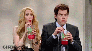 Man And Woman Drinking From Straws GIF