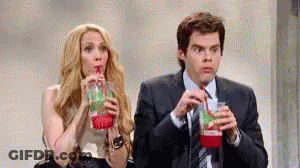 Man And Woman Drinking Through Straws GIF