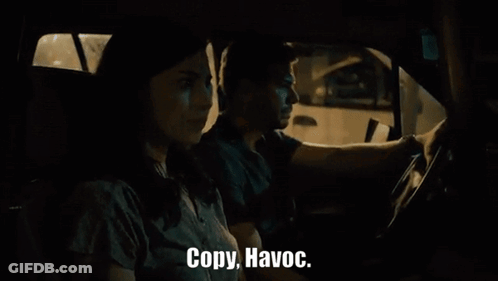 Man And Woman Driving At Night Saying Copy Havoc GIF