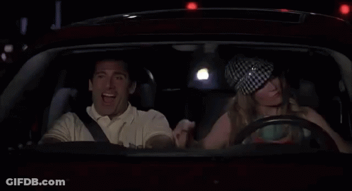 Man And Woman Driving At Night Woman Flexing Muscles GIF