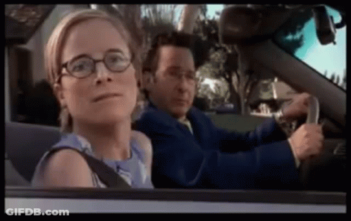 Man And Woman Driving Car, Woman Wearing Glasses GIF